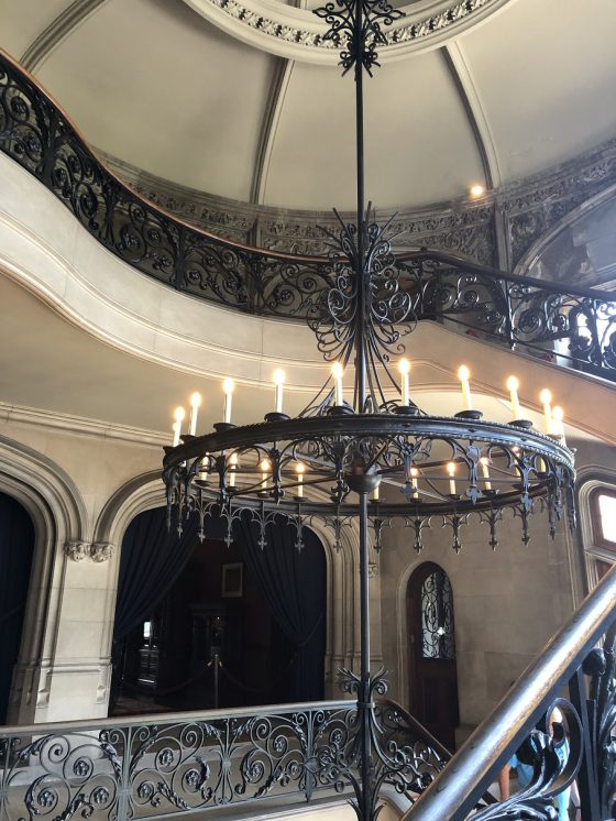 circular staircase, wrought iron chandelier
