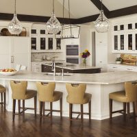 white kitchen, lake house kitchen, two islands, island stools, pendant lights, glass front cabinets, wood floor