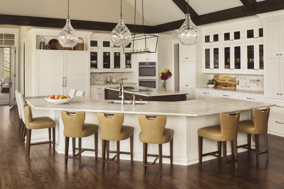 white kitchen, lake house kitchen, two islands, island stools, pendant lights, glass front cabinets, wood floor