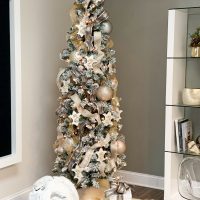 Office Christmas tree, ribbons, metallic balls, fleur-de-lis ornaments, flocked branches