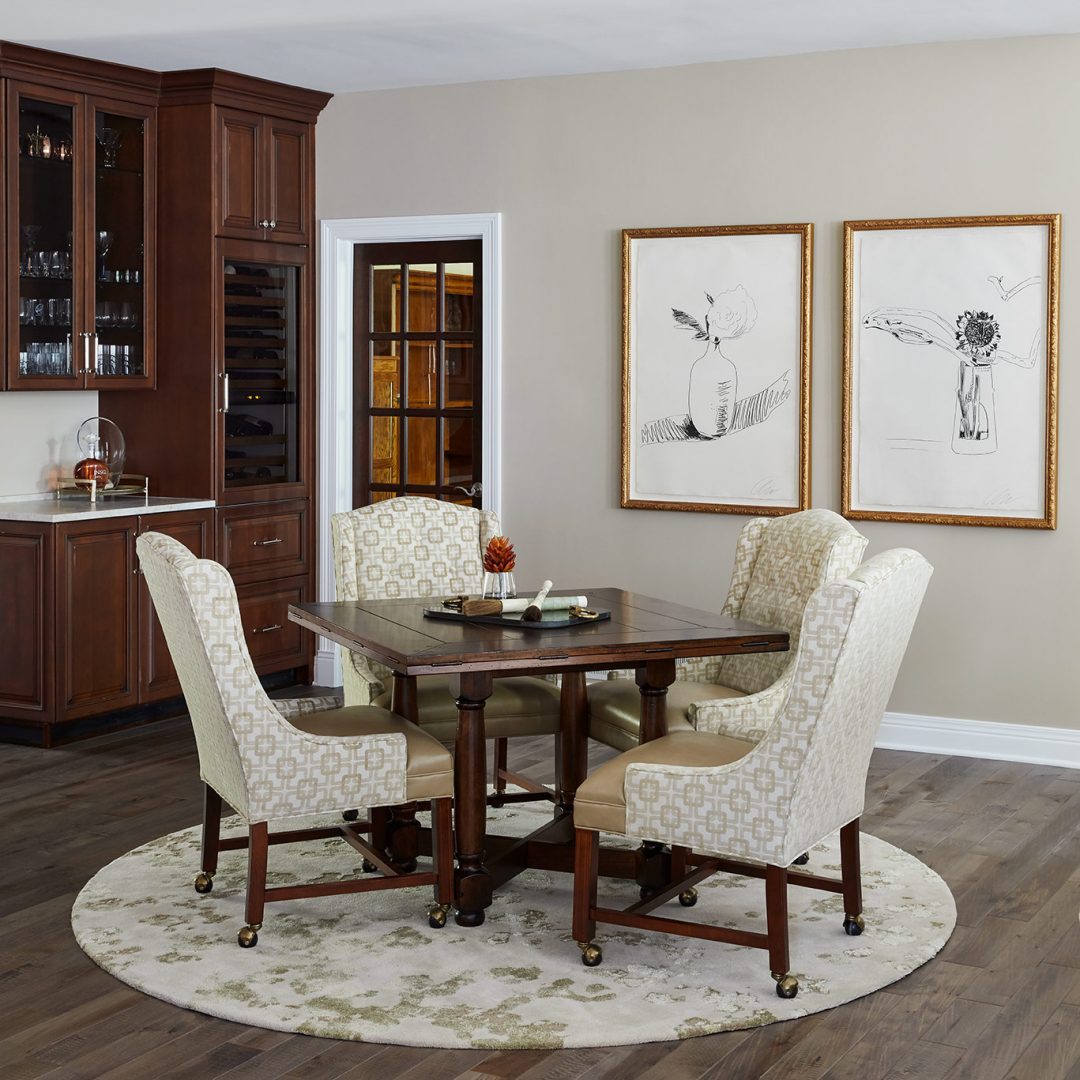 game table, arm chairs, round rug, square table, wall art, wet bar