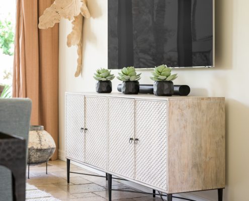 dining room, dining room chest, wall art, rug, wood floor, wall-mounted TV