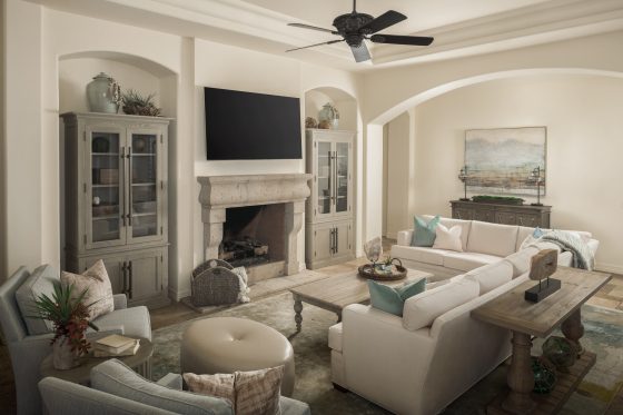 living room, sectional sofa, arm chairs, cocktail table, sofa table, ottoman, fireplace, wall-mounted TV, glass-front cabinets, accessories, pillows