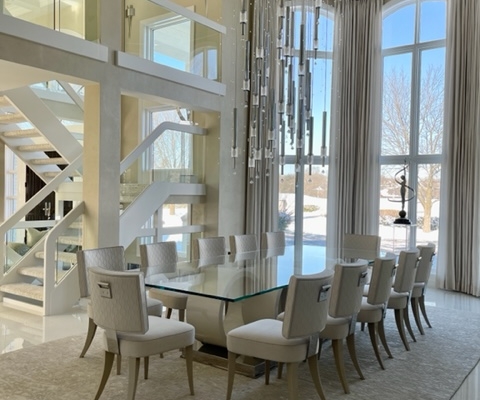 modern dining room, glass-topped table, white dining chairs, rug, chandelier, high ceilings, window treatments, ceiling-to-floor windows