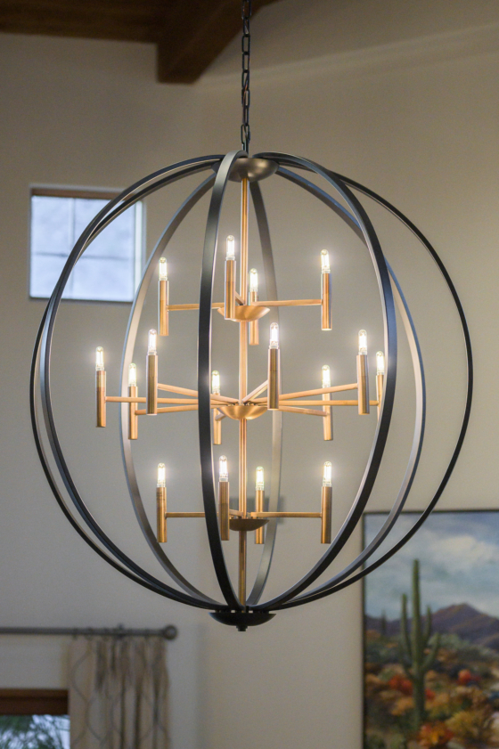 chandelier with black metal cage surrounding cluster of warm brass lights