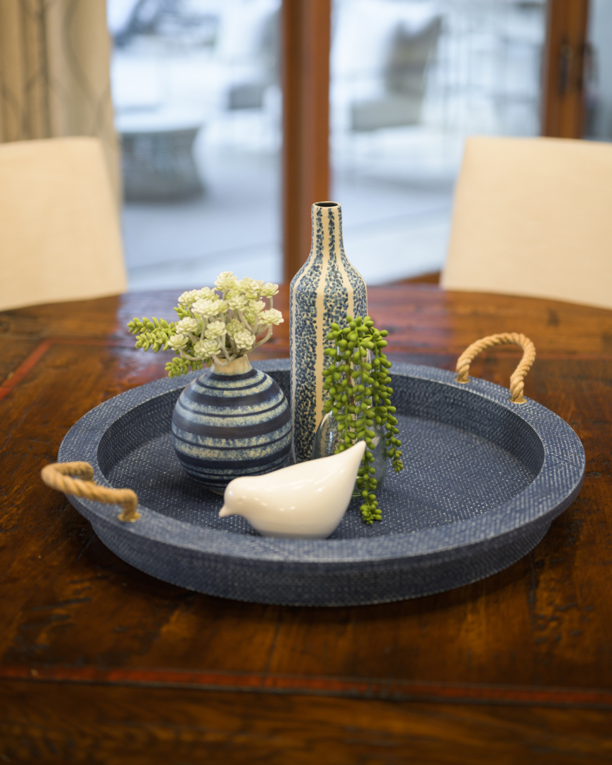 second home, arizona, blue tray, small blue vases, white ceramic bird, wood table